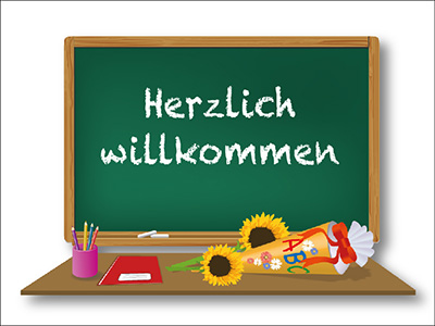Foto von Tafel mit Text "Herzlich willkommen"